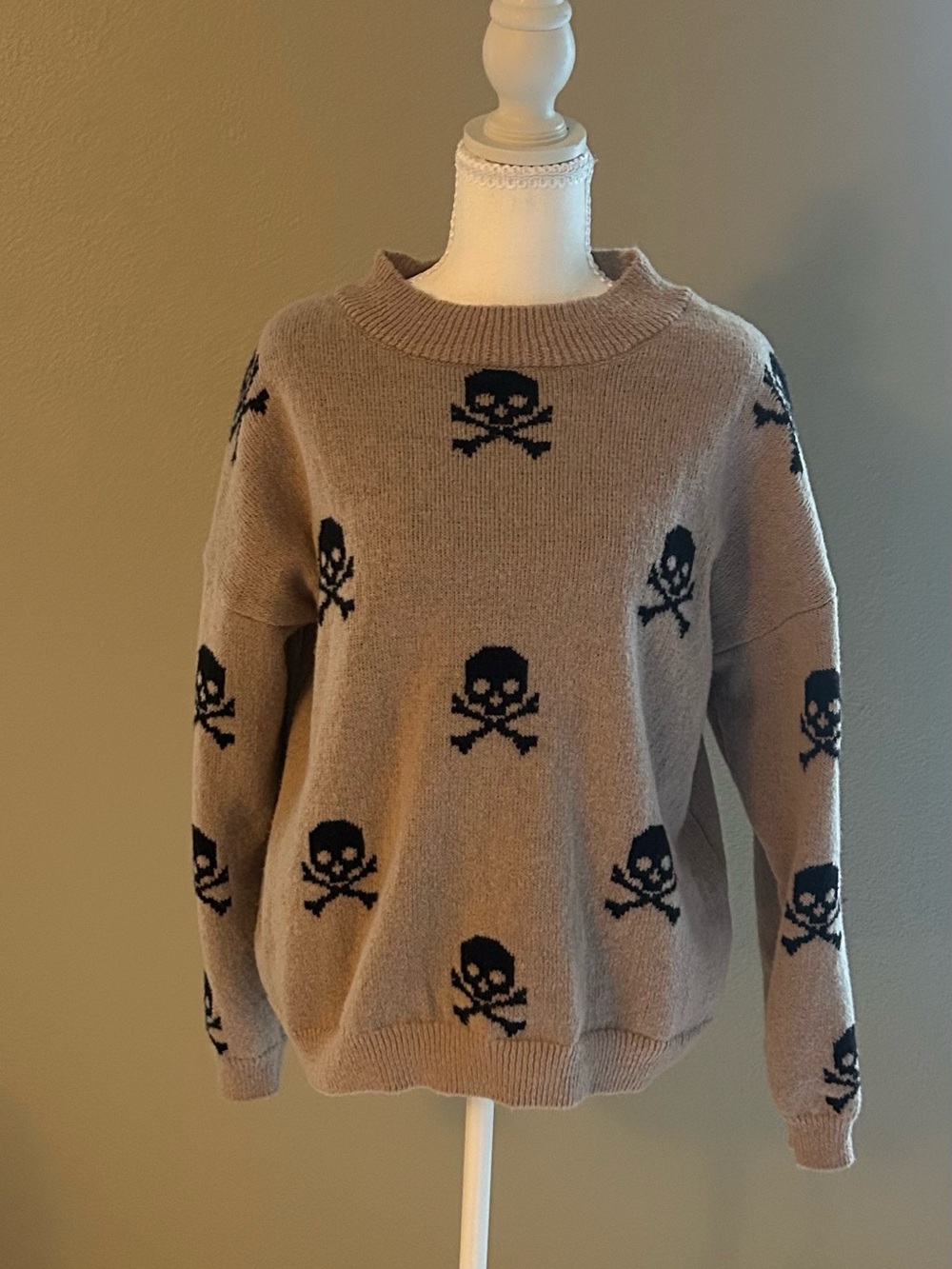 No Boundaries Taupe Sweater with Black Skull Pattern